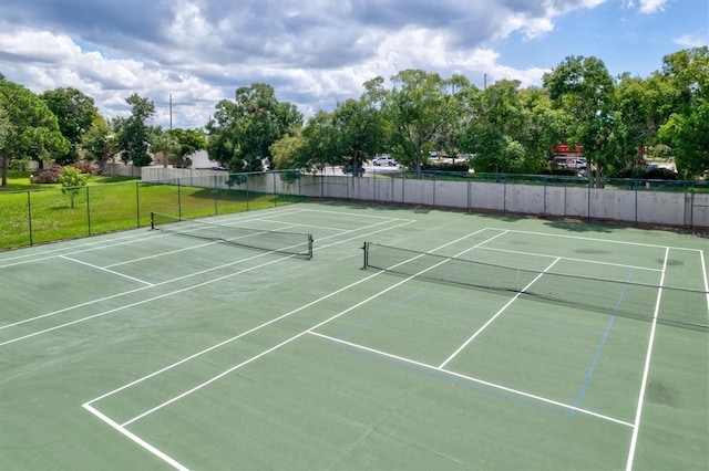 view of tennis court with basketball hoop