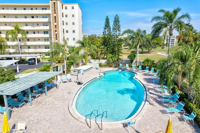 view of swimming pool featuring a patio area