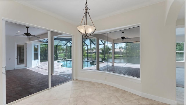 unfurnished dining area featuring crown molding, light colored carpet, and a wealth of natural light