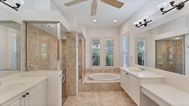 bathroom with shower with separate bathtub, ceiling fan, vaulted ceiling, vanity, and tile patterned flooring