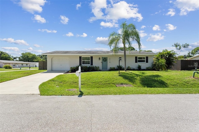 ranch-style home with a front lawn and a garage