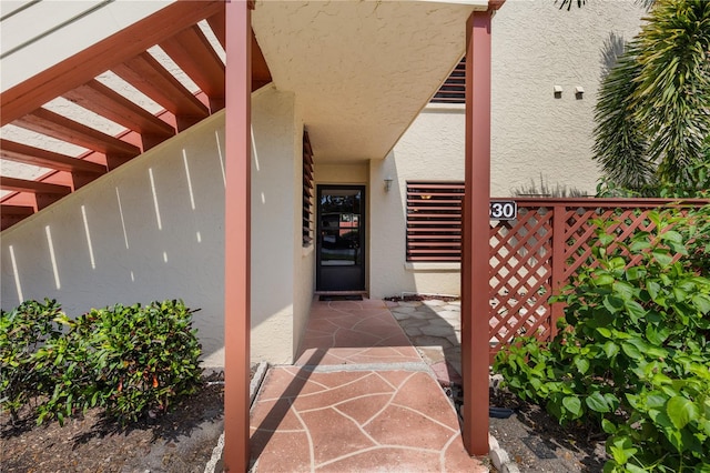 doorway to property featuring a patio area