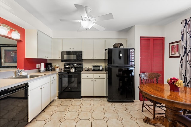 kitchen with black appliances, ceiling fan, sink, and white cabinets