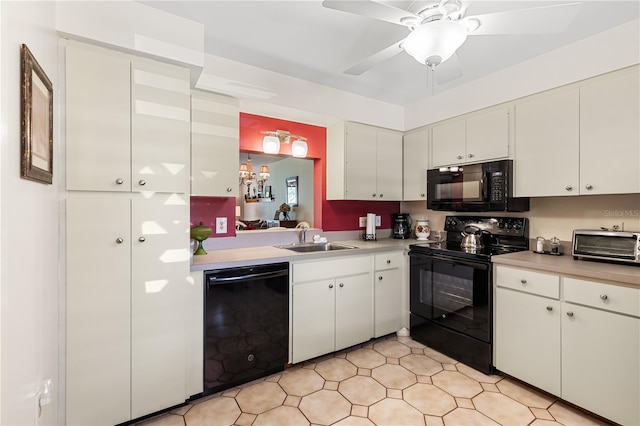 kitchen with black appliances, ceiling fan, white cabinetry, and sink