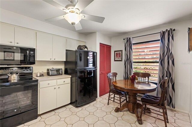 kitchen with white cabinets, black appliances, and ceiling fan