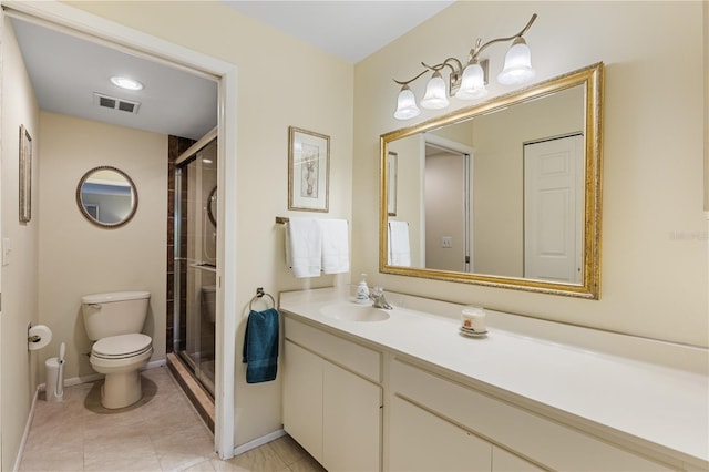 bathroom featuring tile patterned flooring, walk in shower, toilet, and vanity