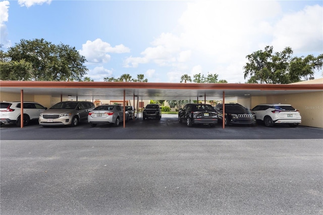 view of vehicle parking featuring a carport