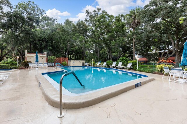 view of swimming pool featuring a patio