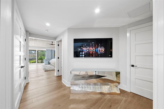 hall with light hardwood / wood-style floors