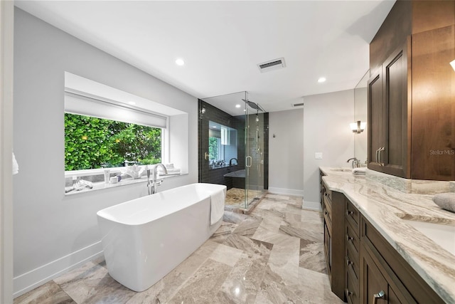 bathroom with independent shower and bath and vanity