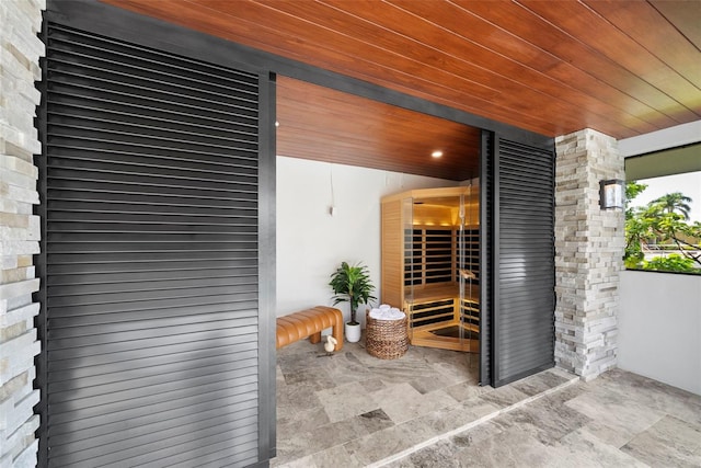 view of sauna featuring wood ceiling