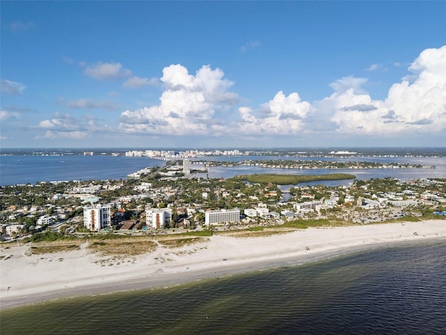 drone / aerial view featuring a beach view and a water view