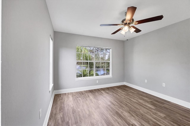 spare room with ceiling fan and hardwood / wood-style flooring