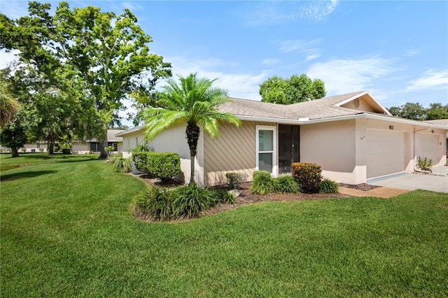 ranch-style house featuring a front lawn and a garage