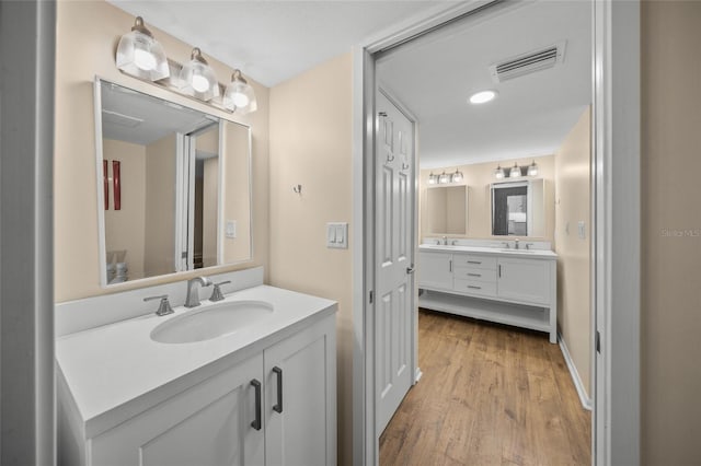 bathroom with wood-type flooring and vanity