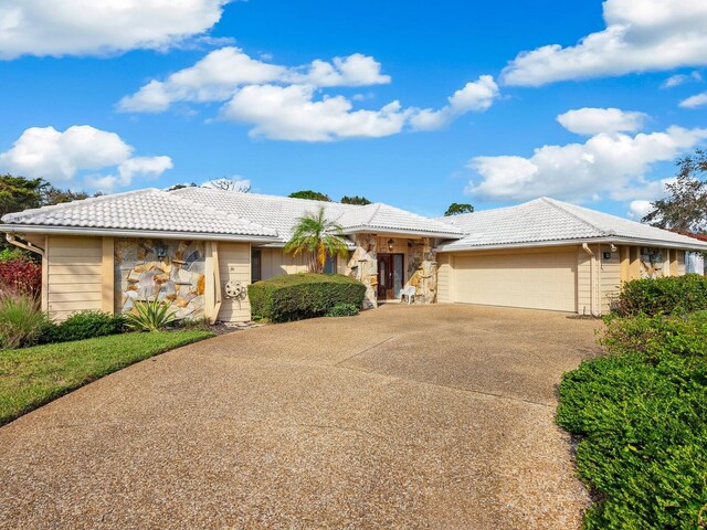 ranch-style home with a garage