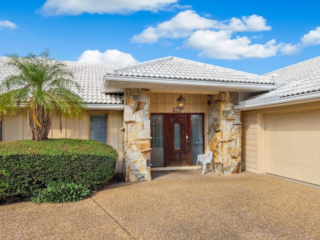 property entrance featuring a garage