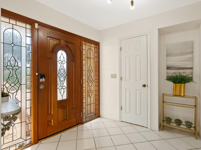 tiled foyer featuring a healthy amount of sunlight