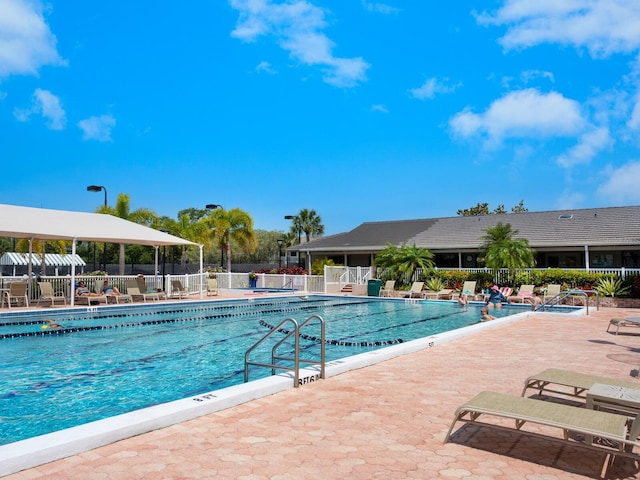 view of swimming pool with a patio area