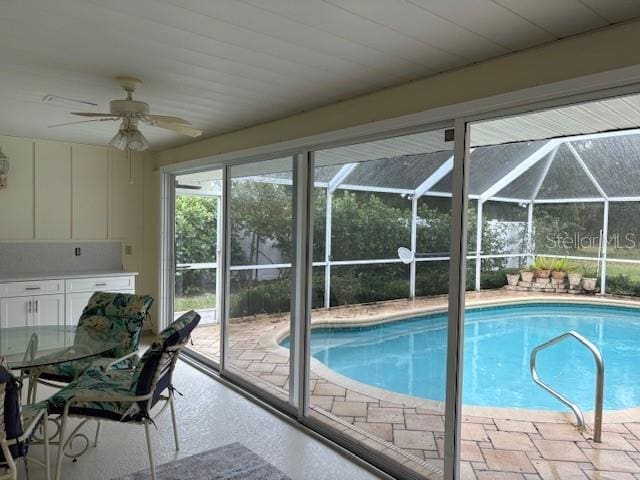 view of pool featuring ceiling fan