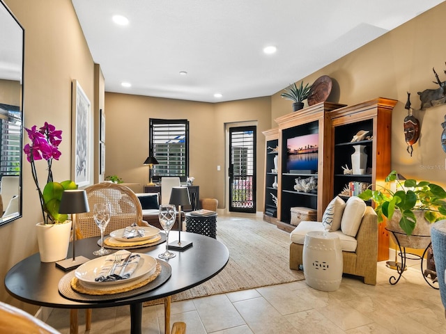 sitting room featuring light tile patterned floors and a wealth of natural light