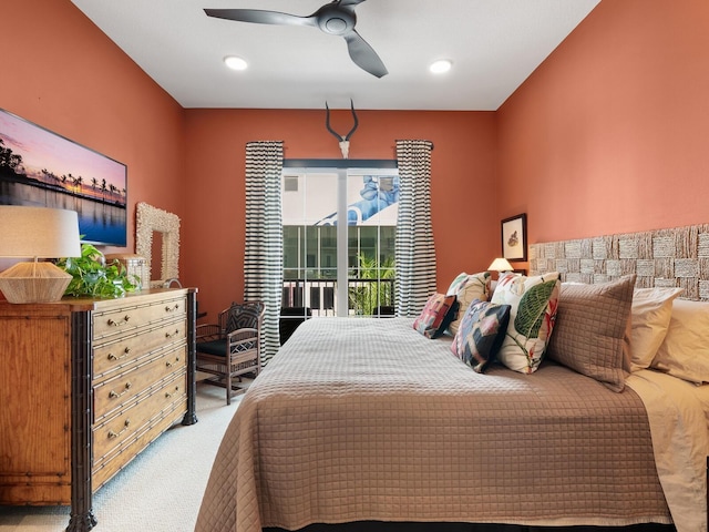 carpeted bedroom featuring ceiling fan and access to outside