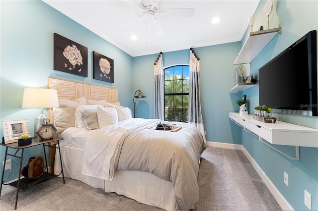 carpeted bedroom featuring crown molding and ceiling fan