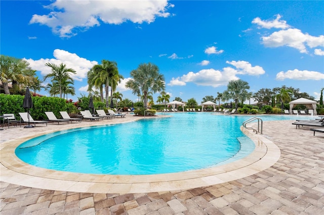 view of swimming pool featuring a patio area