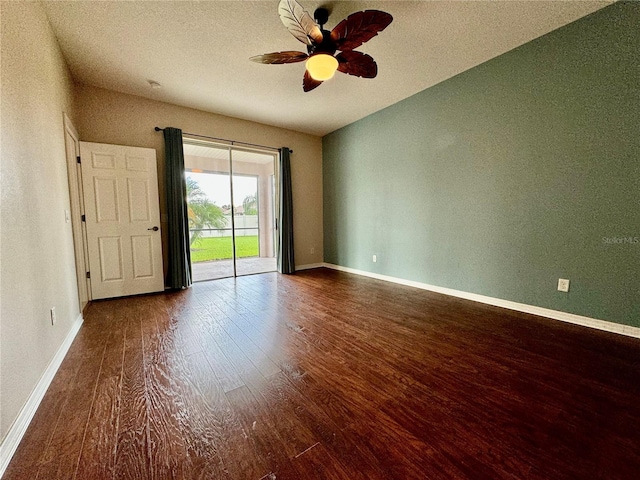 spare room with a textured ceiling, wood-type flooring, and ceiling fan