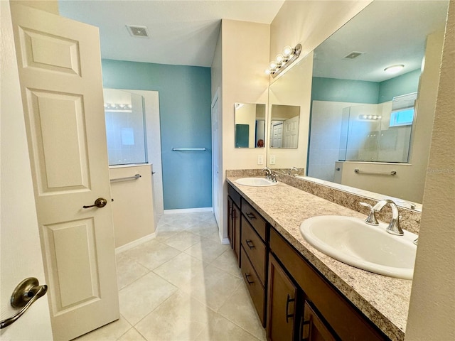 bathroom featuring vanity, walk in shower, and tile patterned flooring