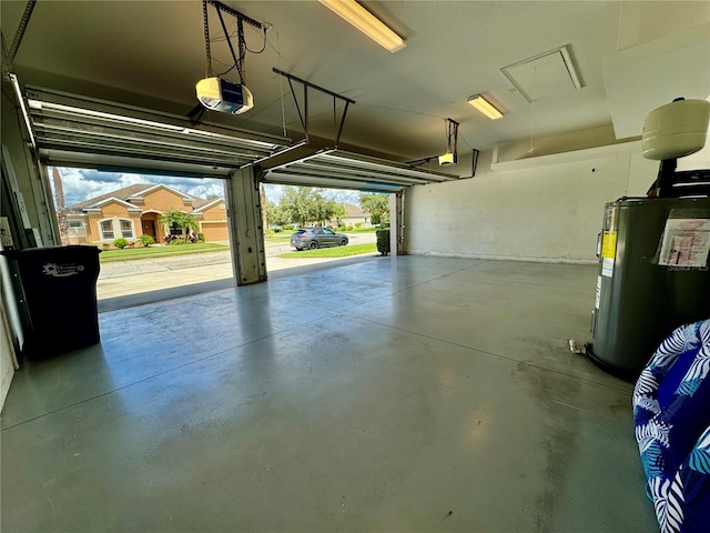 garage with a garage door opener and water heater