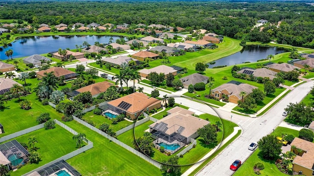 birds eye view of property featuring a water view