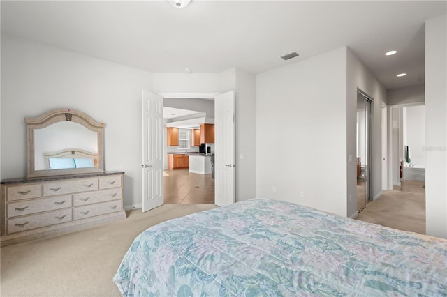 carpeted bedroom with a closet