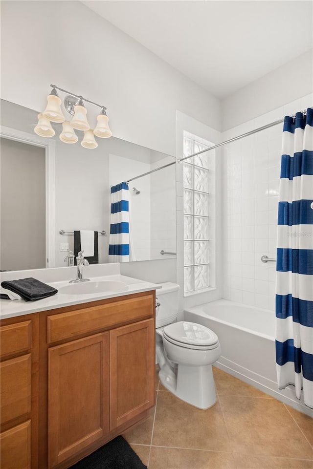 full bathroom featuring vanity, toilet, tile patterned floors, and shower / bath combo