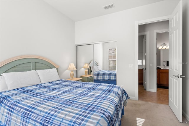 carpeted bedroom featuring a closet