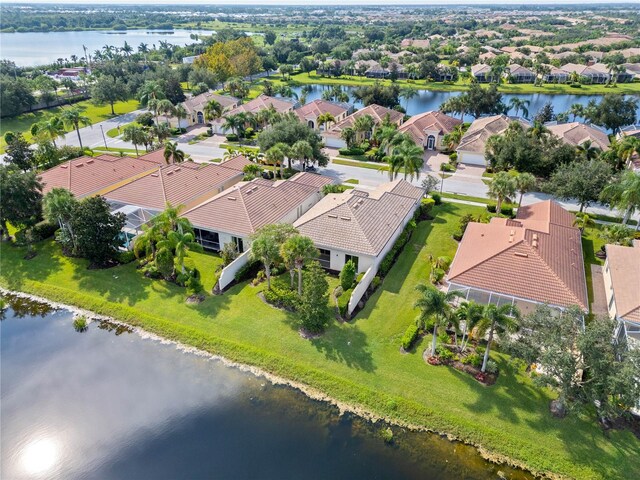 drone / aerial view with a water view