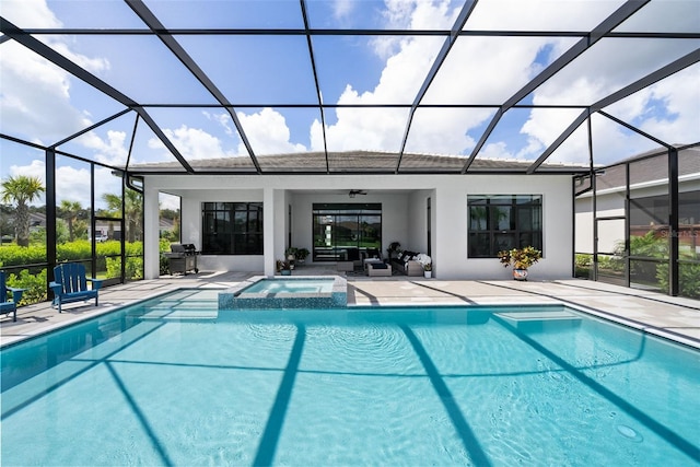 view of swimming pool with a patio, an in ground hot tub, ceiling fan, and glass enclosure