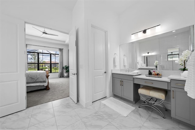 bathroom with ceiling fan and vanity