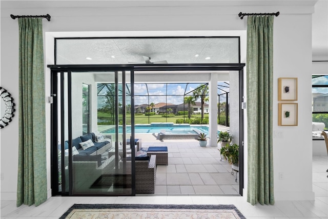 doorway to outside with light tile patterned floors and a healthy amount of sunlight