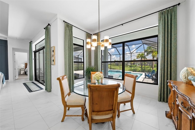 dining area with a notable chandelier and crown molding