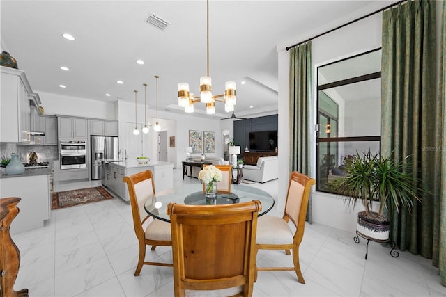 dining area featuring an inviting chandelier