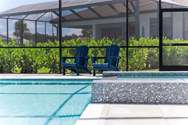 view of pool featuring a lanai