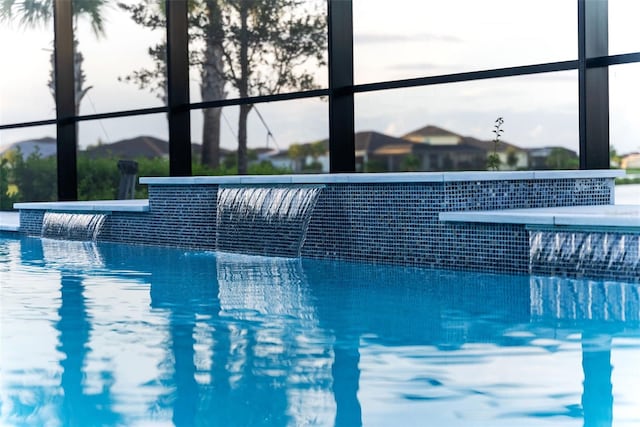 view of swimming pool featuring pool water feature