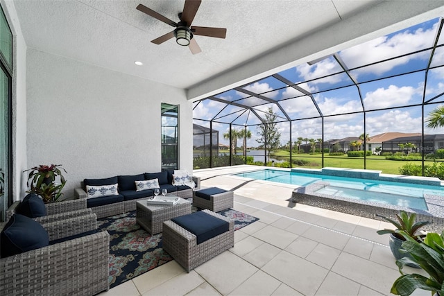 view of swimming pool with a patio, a lanai, ceiling fan, and an outdoor hangout area