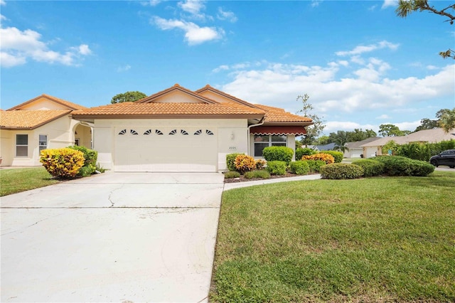 4995 Pepperwood Pl, Venice, FL 34293 - mediterranean / spanish-style house featuring a tiled roof, a garage, stucco siding, a front lawn, and driveway