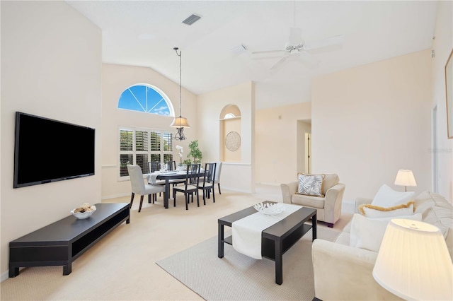 4995 Pepperwood Pl, Venice, FL 34293 - carpeted living area with baseboards, high vaulted ceiling, ceiling fan, and visible vents