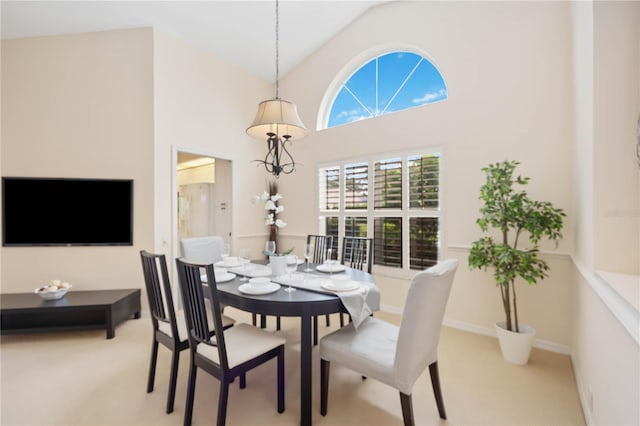 4995 Pepperwood Pl, Venice, FL 34293 - dining area with baseboards, high vaulted ceiling, and carpet flooring