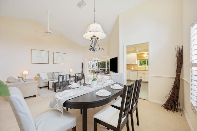4995 Pepperwood Pl, Venice, FL 34293 - dining space with high vaulted ceiling, ceiling fan, visible vents, and light carpet