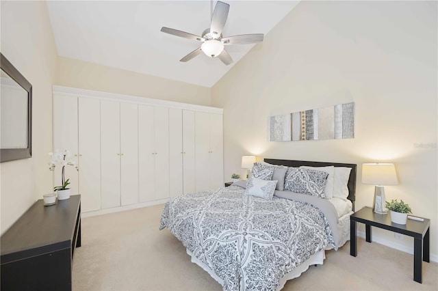 4995 Pepperwood Pl, Venice, FL 34293 - bedroom with light colored carpet, high vaulted ceiling, a closet, and a ceiling fan