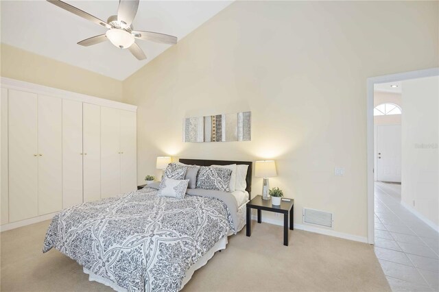 4995 Pepperwood Pl, Venice, FL 34293 - bedroom with high vaulted ceiling, baseboards, visible vents, light carpet, and a closet